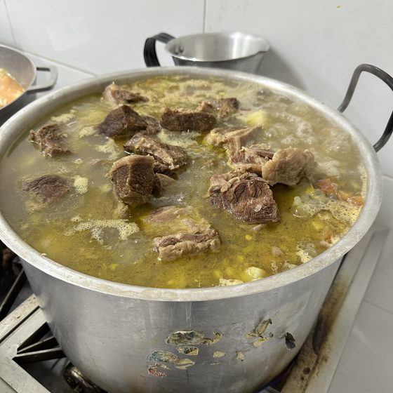 A pot of hot soup prepared for the weekly TIKVA Feeding meal