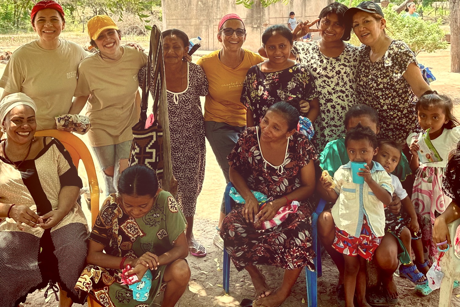 DJ facing a crowd at his deck. Photo with a purple hue